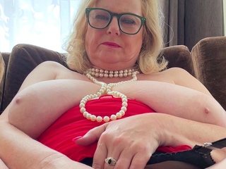 A super sexy blonde with big boobs and masturbating with a v