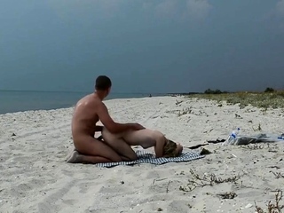 Amateur Nudist MILF Has Doggy-Style Fun at the Beach