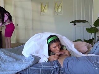 Stepsister sneaks around to suck on the succulent cock behind her mother's back